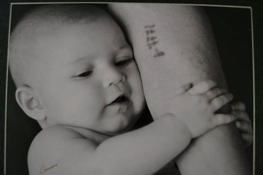 Holocaust survivor holds great-grandchild in powerful photo